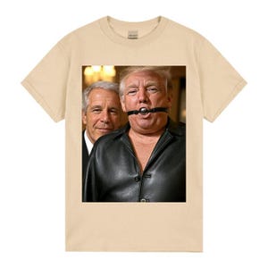 May include: A beige t-shirt with a graphic of two men. One man is wearing a black leather jacket and a ball gag. The other man is wearing a suit and smiling. The t-shirt is made of a soft, comfortable material.