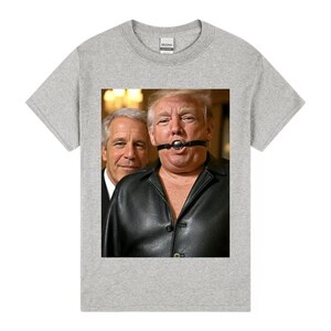 May include: A light grey Gildan t-shirt with a graphic of two men. One is in a black leather jacket and ball gag. The other is in a suit and tie.