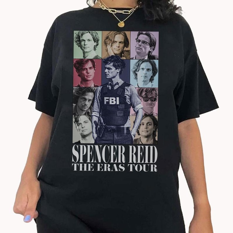 a woman wearing a black t - shirt with pictures of people on it