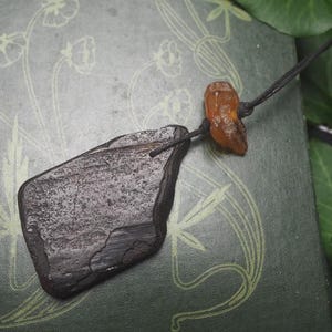 May include: A set of three ceramic mugs with a speckled, matte finish. Each mug features a different color: light blue, cream, and gray. The mugs have a simple, modern design and a comfortable handle.