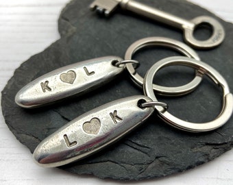 Couples Gift for New Home Keyrings - His & Hers First Home Gift - Solid Recycled Pewter Pebble Keychain - Personalised Couples Date Keyrings