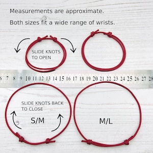 May include: Two red adjustable bracelets with sliding knots. The smaller bracelet measures 6.5 to 7.5 inches and the larger bracelet measures 7.5 to 8.5 inches. The bracelets are labeled "S/M" and "M/L" respectively.