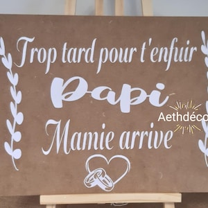 Wooden procession sign: Too late to run away, grandpa, grandma is coming.