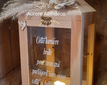 Sage green wooden memorial lantern with pampas grass for weddings or other celebrations, perfect for honoring the deceased.