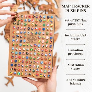 May include: A set of 287 flag push pins, including USA states, Canadian provinces, Australian states, and various islands. The pins are displayed on a brown wooden board with the text "COUNTRY FLAGS" and "ENJOY THE WOOD" printed on it.