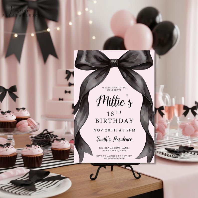 May include: A pink and black 16th birthday party invitation on a small black easel. The invitation features a large black bow design and the text "Millie's 16th Birthday". The party theme includes cupcakes, balloons, and a cake.