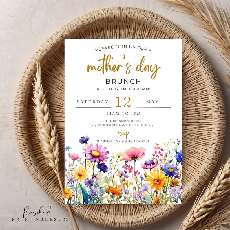 May include: A white invitation card with gold lettering for a Mother's Day brunch. The invitation features a watercolor illustration of colorful wildflowers and the text "Please join us for a mother's day brunch hosted by Amelia Adams Saturday 12 May 11am to 1pm The Johnson's House Wildflower Lane, Daisy Hill, 1555 RSVP to Amelia on by May 5th."