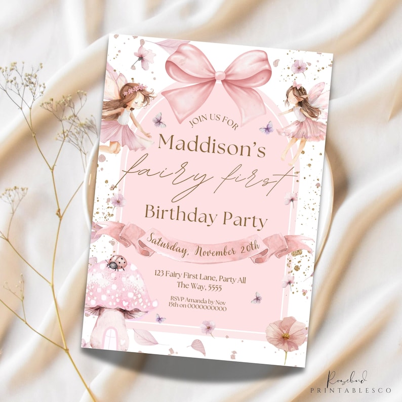 May include: A pink fairy-themed first birthday party invitation. The design includes a large pink bow, fairy illustrations, and the text "Maddison's fairy first Birthday Party". The invitation also includes the date, time, and RSVP details.