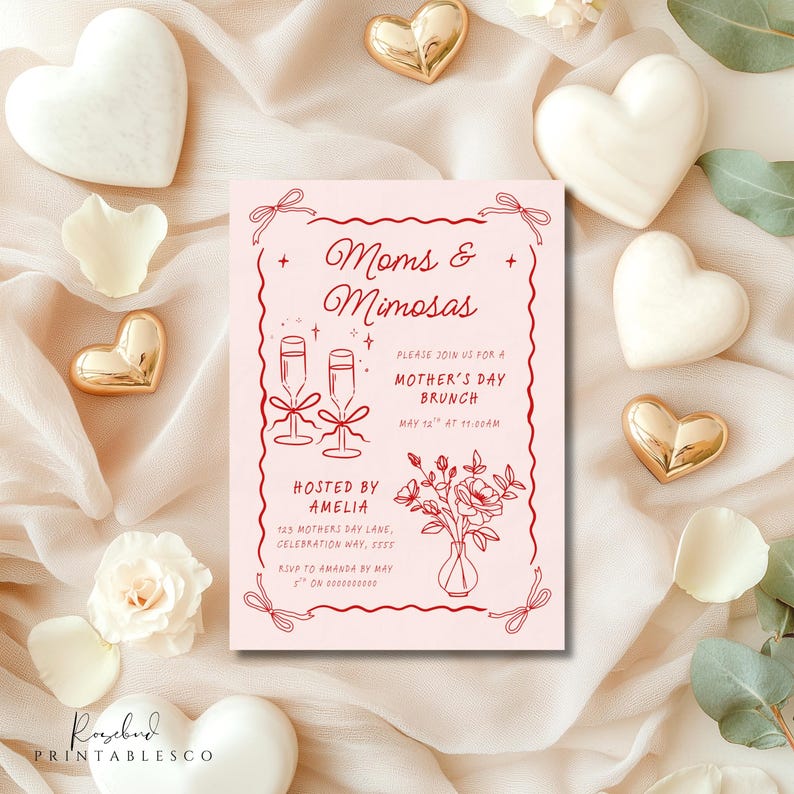 May include: A pink invitation card with red text and illustrations. The text reads "Moms & Mimosas" and "Please join us for a Mother's Day Brunch, May 12th at 11:00am". The illustration shows two champagne glasses and a vase of flowers.