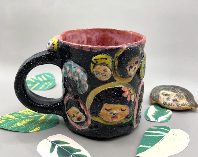 Handmade Ceramic Coffee Mug: Sculpted People Faces, Playful Design