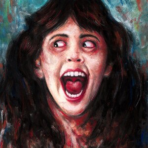 May include: A close-up portrait of a woman with long dark hair, her mouth open in a scream. Her eyes are wide and her expression is one of terror. The background is a blurry blue and green.