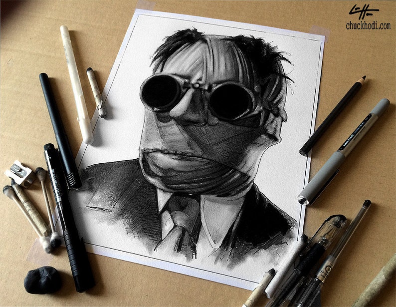 May include: A black and white pencil drawing of a man wearing a suit and goggles. The man's face is covered in bandages. The drawing is on a white sheet of paper.