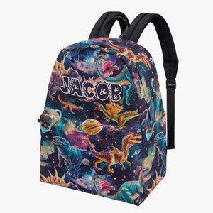 May include: A black backpack with a colourful dinosaur and galaxy print. The backpack has adjustable straps and a zip closure. The name "JACOB" is printed on the front of the backpack.