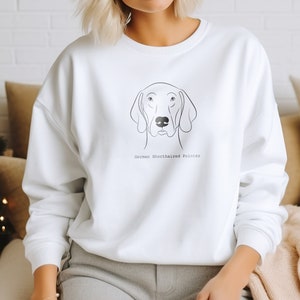 May include: White sweatshirt with a line drawing of a German Shorthaired Pointer dog's head and the text "German Shorthaired Pointer" underneath.