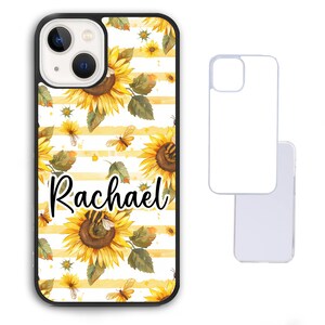 May include: A white iPhone case with a black border. The case features a pattern of yellow sunflowers, green leaves, and yellow and black bees on a white background with yellow stripes. The name "Rachael" is written in black cursive lettering on the case.