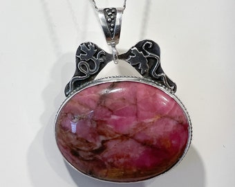 Rhodonite Oval Pendant with Maple Leaf Design in Sterling Silver