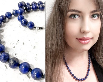 Lapis lazuli bead necklace with sterling silver clasp. 21” long, 9mm diameter.