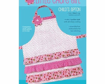 May include: A pink and white child's apron sewing pattern with a ruffled bottom. The pattern is for sizes small, medium, and large. The pattern is called "Little Chore Girl" and is from Cabbage Rose.