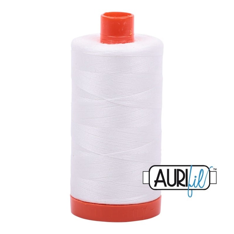 May include: A white spool of Aurifil thread with a red plastic bobbin. The spool is labeled "Aurifil" in blue lettering.