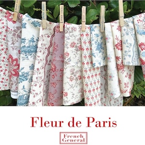 May include: Assorted floral fabric pieces, in shades of red, blue, and cream, hang from a clothesline with wooden clothespins. The text "Fleur de Paris" is displayed below the fabrics, with "French General" in a box beneath.