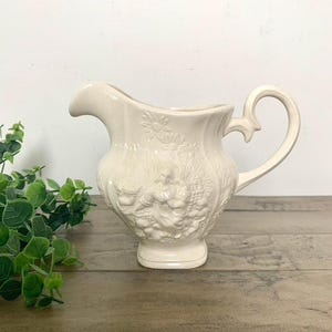 1970s Vintage Ceramic Pitcher with Embossed People and Flowers
