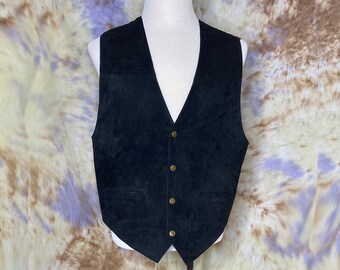 May include: A black suede vest with a V-neck and five brass buttons.