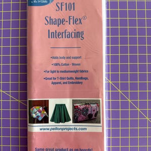 May include: Pink package of Pellon SF101 Shape-Flex interfacing. The package includes the text "Adds body and support", "100% Cotton - Woven", and "For light to mediumweight fabrics". The package is 20 inches x 1 yard (0.9m).