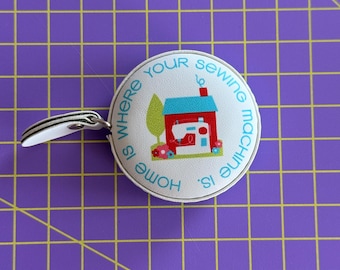 Home is Where your Sewing Machine is- 60" retractable tape measure.