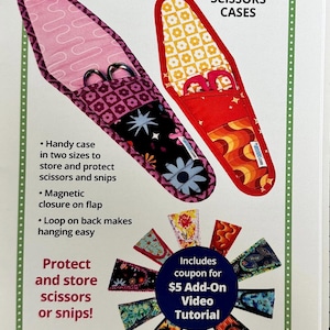 May include: Cut It Out! Scissors Cases sewing pattern with a pink and red scissor case with a magnetic closure and a loop for hanging. The pattern includes a coupon for a $5 add-on video tutorial.