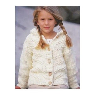 May include: A cream-coloured, long-sleeved, hooded cardigan sweater featuring a textured chevron knit pattern and four light-coloured buttons down the front. The garment is constructed with a thick yarn and includes a hood and ribbed cuffs.