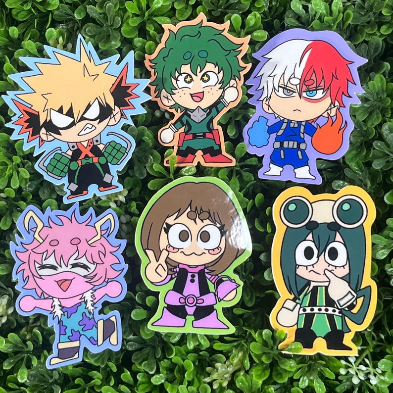May include: A collection of colorful cartoon character stickers. The stickers feature characters with distinctive hairstyles and outfits, including a character with spiky blonde hair and another with green hair. The stickers are set against a green background.