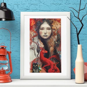 Puede incluir: Una impresión artística enmarcada que presenta a una mujer, un zorro rojo y un gato negro. La obra de arte tiene una paleta de colores cálidos con rojos, naranjas y marrones. La impresión se exhibe en un estante blanco contra una pared de ladrillos azules.