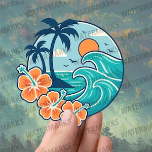 May include: A round sticker featuring a tropical beach scene with palm trees, ocean waves, and an orange sun. Orange hibiscus flowers are in the foreground. The sticker is held by a hand.