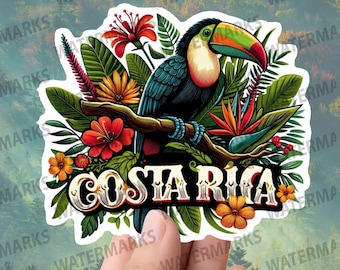 May include: A vibrant sticker depicting a toucan amidst tropical flowers and leaves, with the text "COSTA RICA". The toucan has a colorful beak and plumage. The background is a blurred forest scene.