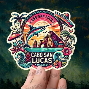 May include: A colorful sticker featuring Cabo San Lucas, Mexico. The design includes a jumping marlin, a sombrero, palm trees, and the text "Cabo San Lucas Mexico". The sticker has a sunset background and ocean waves.