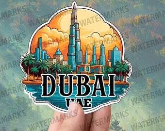 May include: A vibrant sticker depicting the Dubai skyline, including the Burj Khalifa. The sticker displays the word "DUBAI" in bold text, with "UAE" underneath. The design incorporates palm trees, buildings, and a sunset.