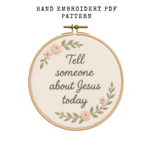 May include: A hand embroidery PDF pattern in a wooden hoop. The design features the text "Tell someone about Jesus today" in gray script, surrounded by embroidered flowers and leaves in soft pastel colors.