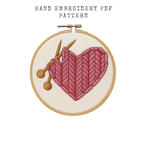 May include: A hand embroidery PDF pattern showing a pink heart design with knitting needles. The heart is made of stitched yarn, and the needles are gold. The text "HAND EMBROIDERY PDF PATTERN" is at the top.