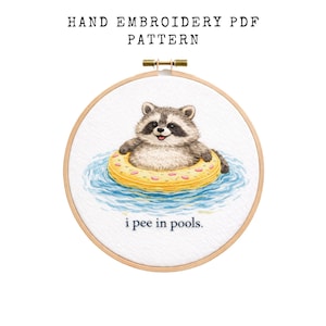 May include: Hand embroidery PDF pattern featuring a raccoon floating in a pool on a yellow inflatable ring. The raccoon is in the center of the embroidery hoop, with the text "i pee in pools" below.