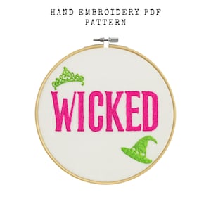 May include: A hand embroidery PDF pattern featuring the word "WICKED" in bright pink, embroidered on white fabric. The design includes a green tiara and witch hat. The text "HAND EMBROIDERY PDF PATTERN" is at the top.
