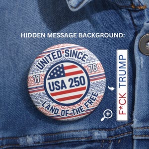 May include: A circular pinback badge displaying a red, white, and blue American flag motif with the text "UNITED SINCE 1776", "USA 250", and "LAND OF THE FREE". An adjacent graphic reveals the hidden message "F*CK TRUMP" in red and blue lettering.