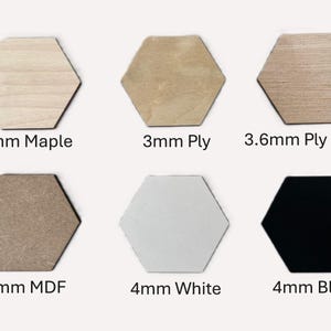 May include: Six hexagonal wood shapes in different colors and materials. The shapes are labeled with their thickness and material: 4mm Maple, 3mm Ply, 3.6mm Ply Grain, 4mm MDF, 4mm White, and 4mm Black.