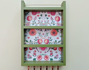 hanging spice rack in green with peaches background, 4 shelf or 3 shelf wall mount kitchen storage for spices or essential oils