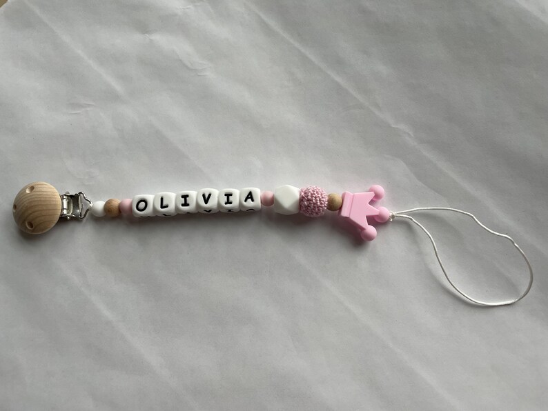 Pink pacifier clip with personalized name