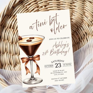 May include: A cream-coloured birthday invitation featuring a martini glass illustration. The glass contains a coffee-coloured drink and coffee beans. Text includes "a tini bit older" and "Ashley's 25th Birthday!"