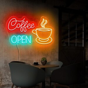 May include: Neon sign with the words "Coffee Open" in red and blue, and a stylized orange coffee cup with steam rising from it.