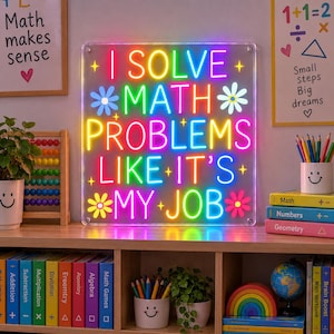 May include: A rectangular neon sign on a clear acrylic backing featuring the multi-colored text I SOLVE MATH PROBLEMS LIKE IT'S MY JOB, accented with small neon flower and star shapes in vibrant shades of pink, yellow, blue, and green.