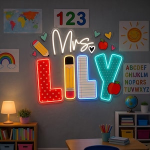 May include: A custom neon sign displaying the text Mrs. LILY in a classroom theme. The letters feature patterns including red polka dots, a yellow pencil, lined notebook paper, and teal dots, accented by a red apple and small hearts.