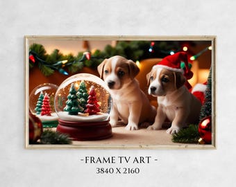 May include: Two brown and white puppies wearing Santa hats sit in front of a snow globe with a Christmas tree inside. The snow globe is on a wooden base and the puppies are surrounded by Christmas decorations.