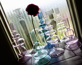 Glass candleholders in blues and purple for table decoration and home decor